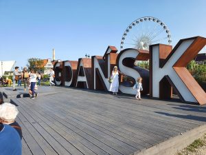 By the river this massive sign welcomes people to Gdansk